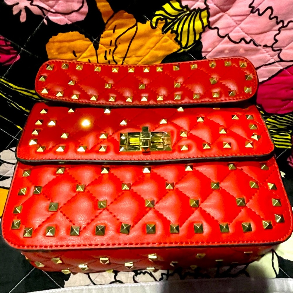 Red studded purse